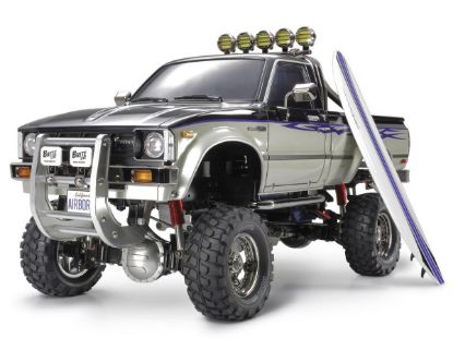 Picture of Tamiya 58397 Toyota Hilux High-Lift Electric 4X4 Scale Truck Kit w/3-Speed & Surfboard